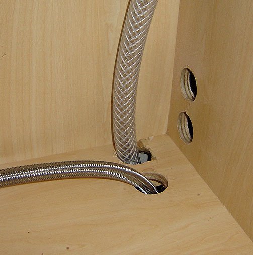 dishwasher-water-feed-drain-hose-under-sink.jpg