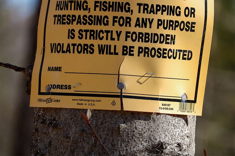 cracked-plastic-no-trespassing-sign.jpg