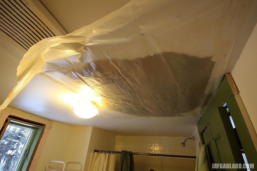 tearing-hole-in-sheetrock-ceiling.jpg