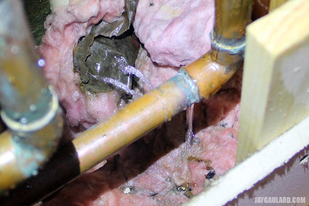 water-spraying-out-of-copper-water-pipe.jpg
